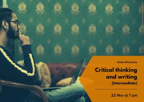 A masculine figure sat pondering with his laptop